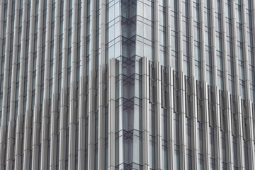 Fototapeta premium Silver and blue modern building tempered glass structure vertical line texture