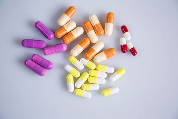 Pigment, tablet or pill. A collection of medicines and vitamins. Dietary supplementation