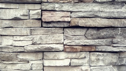 pared de piedras rectangulares. Marrón claro.