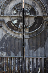 Iron gate with a pattern of rust. Concept - closed entrance