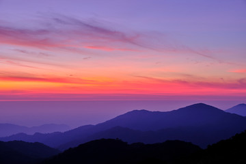 Twilight light pink and purple colors beautifully. reflect the views Mountains and fog in the morning. Khao Jed Yod, Trang in Thailand.