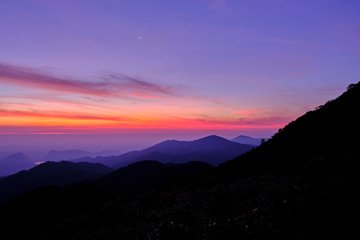 Twilight light pink and purple colors beautifully. reflect the views Mountains and fog in the morning. Khao Jed Yod, Trang in Thailand.