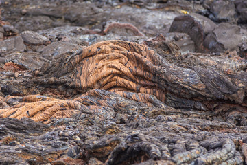 Grey, fresh lava field and glossy rocky land near Volcano Tolbachiskiy, Kamchatka, Russia.