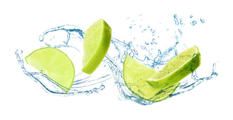 Fototapeta na wymiar Slices of juicy lime and splashing cold water on white background