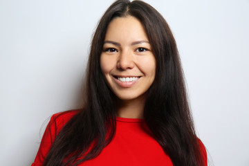 Attractive young woman posing on light background