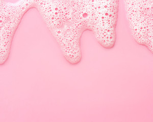 soap foam on delicate pink background with copy space - obrazy, fototapety, plakaty