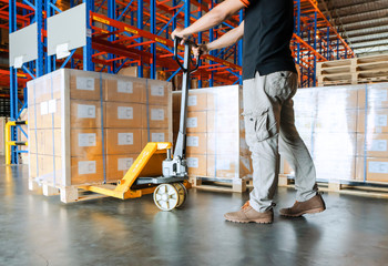 Workers Unloading Packaging Boxes on Pallet in The Warehouse. Cardboard Boxes. Shipping Supplies Warehouse. Shipment Boxes. Storehouse. Cargo Warehouse Logistics.