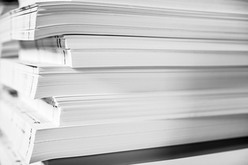 A huge pile of paper in the printing house. Printing industry texture Background