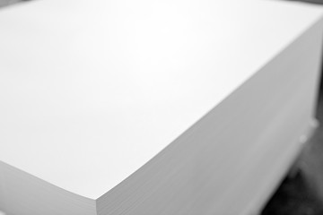A huge pile of paper in the printing house. Printing industry texture Background