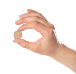 Fototapeta na wymiar Man holding coin in hand on white background, closeup