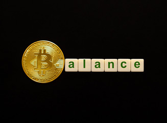 Word Balance made up of cubes. The first letter of the word is symbolized by a bitcoin coin....