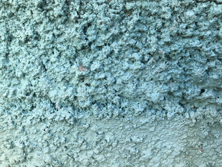 Turquoise rough concrete wall background