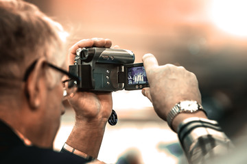 Man filming on video camera - 270258858