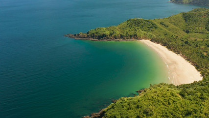 Sandy beach on tropical island, aerial view. El nido, Philippines, Palawan. Seascape with tropical island, ocean blue water. Summer and travel vacation concept