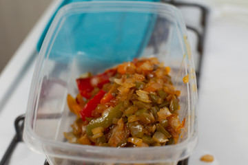 Onions and Peppers in Plastic Container