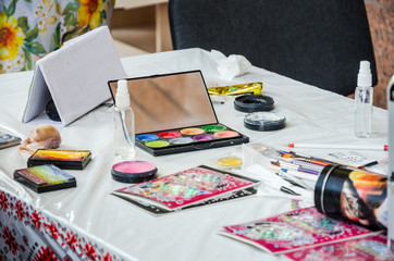 Concept drawing by brush and colorful paints on the table. 