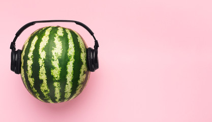 Summer music with tropical sounding mood, watermelon in headphones