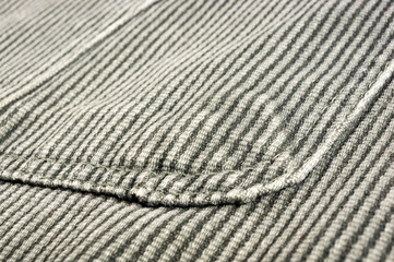 clothing items stonewashed cotton fabric texture with seams, clasps, buttons and rivets, macro