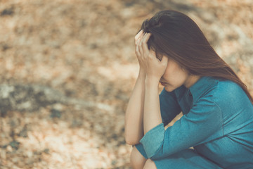 Beautiful thai woman very sad from unrequited love,rethink,think over,vintage style,dark tone,broken heart,asian girl