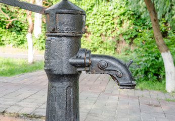 Water from the tap in the park.old style tap water sport in public park