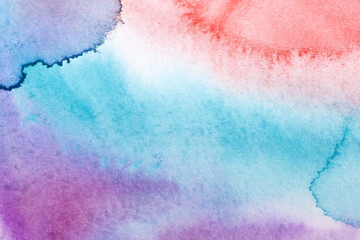 watercolor background filled blue wet paint drawing technique, purple red with stains of paint spread over the paper. on textured watercolor paper paint
