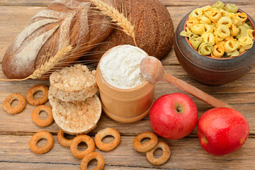 Tasty and healthy products and breads on table