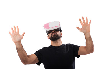 Fototapeta premium Bearded man use virtual reality glasses, goggles. Isolated. Guy in VR headset is looking at interactive screen. Playing mobile game app on device.
