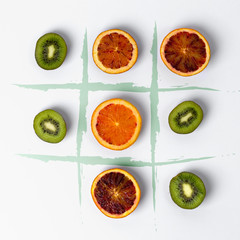 Tic tac toe made of kiwi and blood oranges