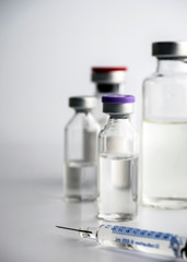 Medicine in vials and syringe ready for vaccine injection