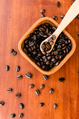 Coffee Beans In A Wooden Bowl On Rich Wood Background
