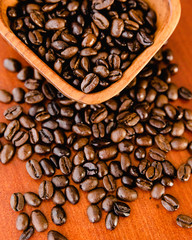 Coffee Beans In A Wooden Bowl On Rich Wood Background