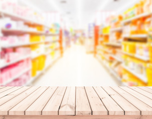 Wood table or wood floor with supermarket blur background for Product display