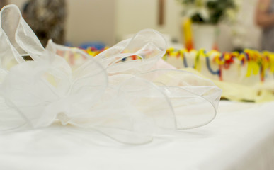 Fototapeta na wymiar Colorful laced ribbon on cake table