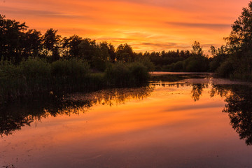 Sunset in the national park near Waterschei in Genk, Belgium with amazing colors in the sky. The park is a former mining area with amazing views