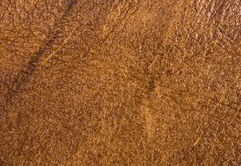 Old vintage genuine soft brown leather texture background, top layer with pores and scratches, macro, close-up