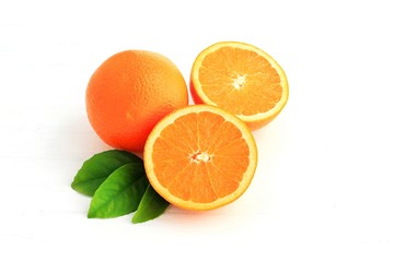 Orange fruit and one cut in half, with leaf isolated on white background.