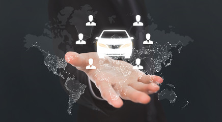 Hand with virtual car sharing icons and world map