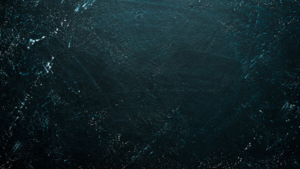 Black stone background. Top view. Free space for your text.
