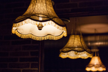 Chandelier and reflection in mirror.