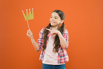 Happiness and joy concept. Fun and humor. Girl child having fun. International childrens day. Superior princess. Nice day to have fun with photo booth props. Playful mood. Golden crown suits her