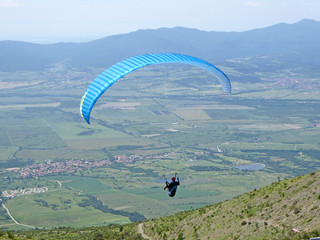 Paraglider flying from Sopot in Bulgaria