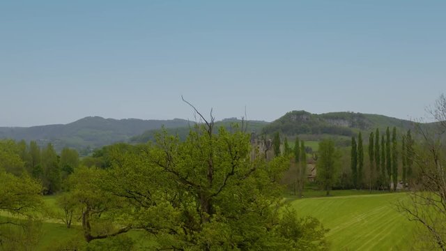 Landscape from backside of  Castle of Montal. It is surrounded by green meadows, trees  also a splendid a garden