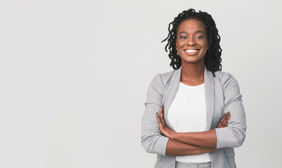 Successful African Businesswoman With Arms Crossed, Grey Background - obrazy, fototapety, plakaty