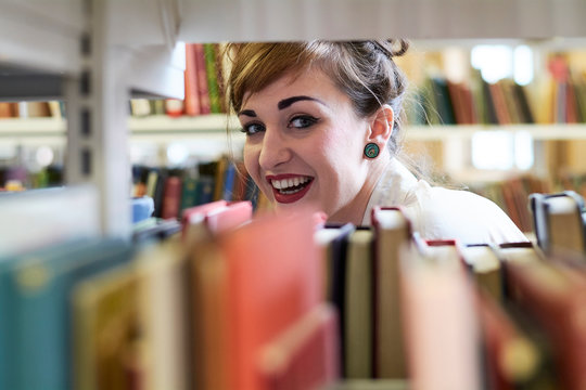 Portrait Of Student Standing In Library