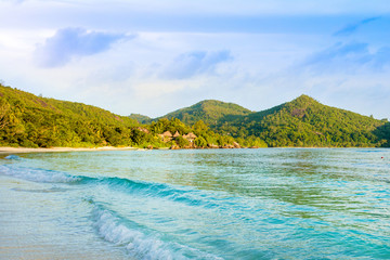 Beautiful tropical landscape with green hills on the shores of the Indian Ocean
