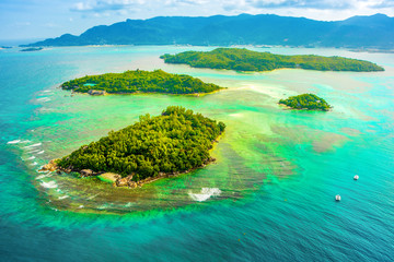 Aerial view of the tropical Mahe Island and beautiful lagoons - obrazy, fototapety, plakaty