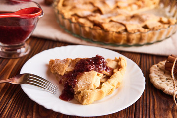 Composition with homemade tasty apple pie on wooden table. Apples. Linen towel. Wooden background