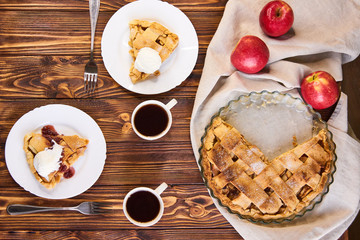 Homemade apple tart. Served table for two. Traditional dessert for Independence Day in America. Rustic style. Top view