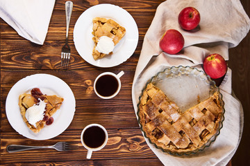 Homemade apple tart. Served table for two. Traditional dessert for Independence Day in America. Rustic style. Top view