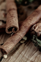 cinnamon sticks and powder on wooden background